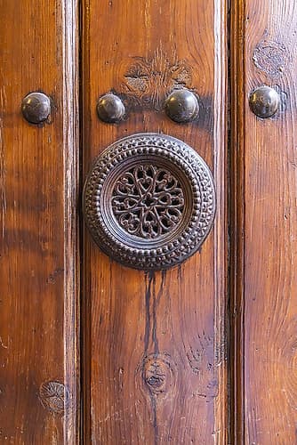 Centro District, Cordoba, Andalusia, Spain. Metal peep hole on an old Spanish door. Art Print